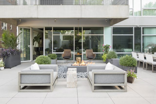 Comfortable outdoor seating area with fire pit - design by Savvy Design Group